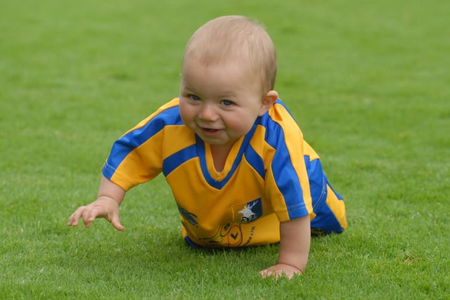 Nine month old Stags fan Finley Arnold tries out the Field Mill pitch