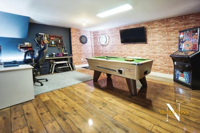 A garage at the £510,000 property has been converted into this exciting games room by the current owners. The versatile space could be put to multiple uses, though.