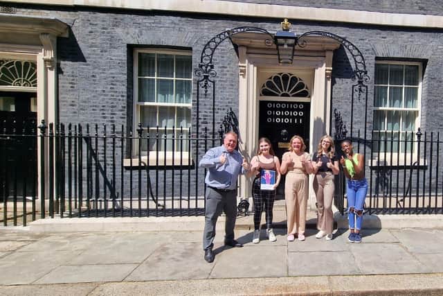 Terry Galloway pictured outside 10 Downing Street alongside those who have lived experience in the care system. Picture: Local Democracy Service