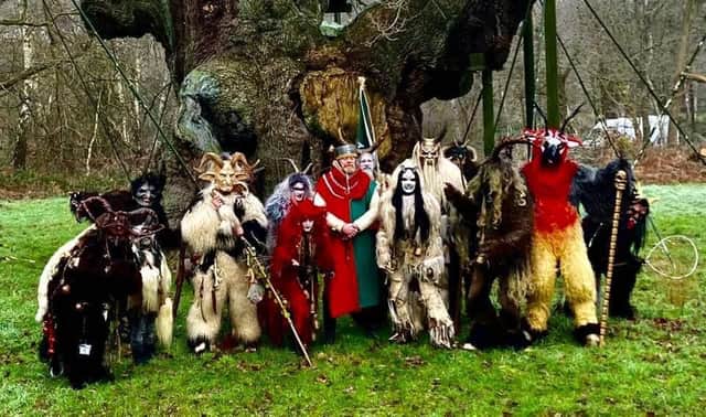 A terrifying collection of scary 'Krampus' creatures  (from the Whitby Krampus Run group) are seen gathering at the Major Oak in Sherwood Forest.  They are pictured with the Sheriff of Nottingham (Richard Townlsey) during the Spirits of the Forest and Wassailing weekend. The Krampus along with evil spirits of the forest, were sent on their way during a traditional 'wassailing' ceremony.
The Krampus is a central European legend, concerning a half-goat, half-demon creature that punishes naughty children at Christmastime whilst ‘wassailing’ is a Twelfth Night tradition, rooted in the pagan custom of visiting orchards to sing to the trees and spirits in the hope of ensuring a good harvest. 
A spiced mulled cider brew is traditionally drunk from a special wassailing.