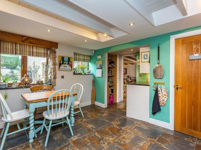 The kitchen boasts a comprehensive range of wall and base units, with granite work surfaces. There is also a walk-in pantry (right), an amazing floor and space for a breakfast table.