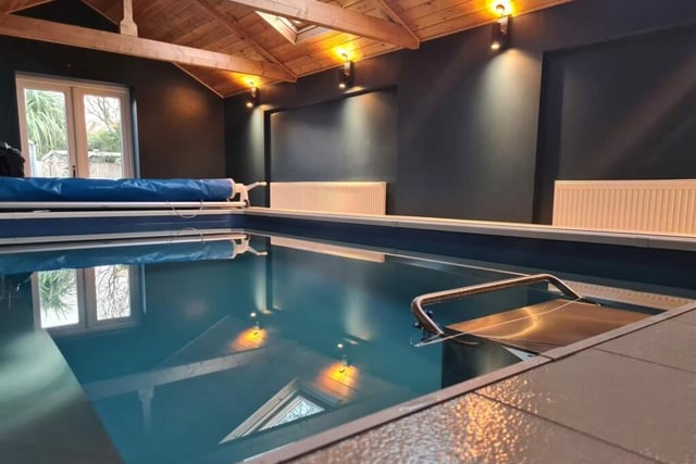 This is what you've been waiting for -- the marvellous indoor swimming pool, complete with a vaulted ceiling and three skylights. It has a tiled floor and patio doors that lead out to the garden. A shower room and changing room are not far away.