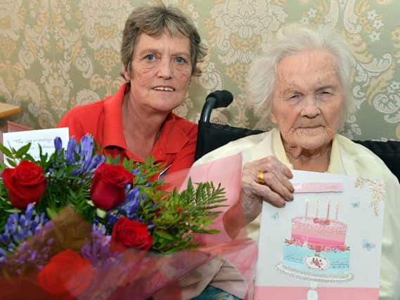 Maybel Lanper celebrates her 100th birthday with activity coprdinator Stephanie Pridnore at the Old vicarage care home Worksop.