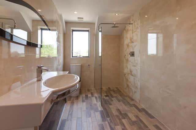 Fitted with a shower, wash basin and wc.