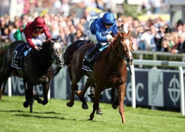 Masar, ridden by Willam Buick, storms home from Dee Ex Bee (far side) and Roaring Lion to spring an upset in the Investec Derby at Epsom.
