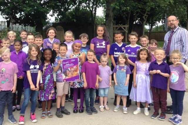 Pupils at Redlands are pictured with the president of Worksop Rotary Club, Fran Walker.