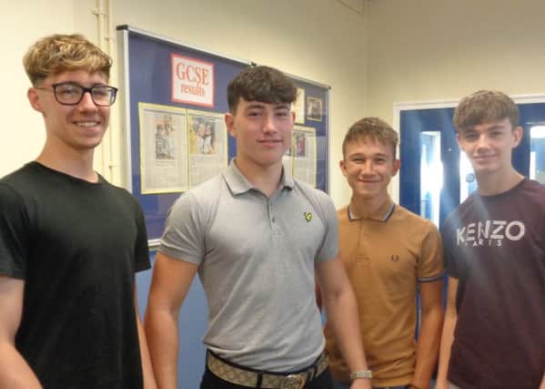 Students from Queen Elizabeth's High School collect their GCSE results