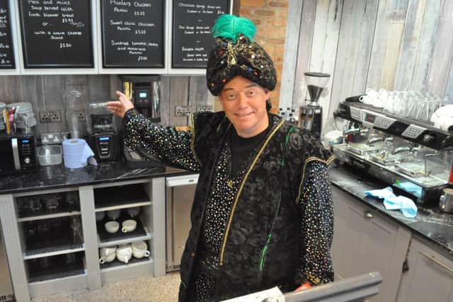 Ricky Groves, as Abanazar, putting in a shift at Kings Coffee Shop in Retford.