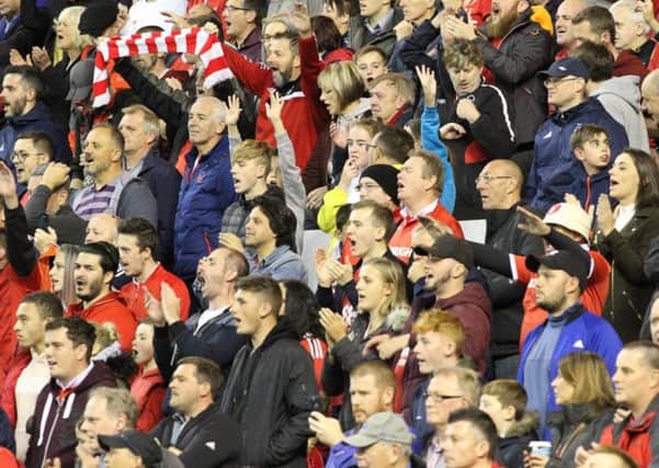 Nottingham Forest fans pictured at The City Ground watching the Reds take on Sheffield Wednesday. Pics by Jez Tighe.