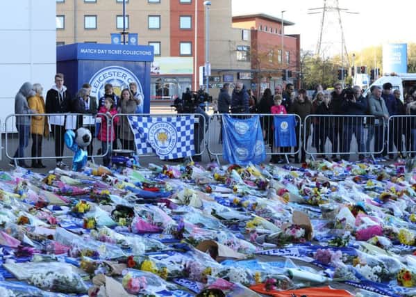 Flowers and tributes left at the King Power Stadium in Leicester the morning after the helicopter crash.