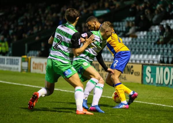 Mansfield Town's CJ Hamilton takes on the Yeovil defence. (PHOTO BY: Chris Holloway)