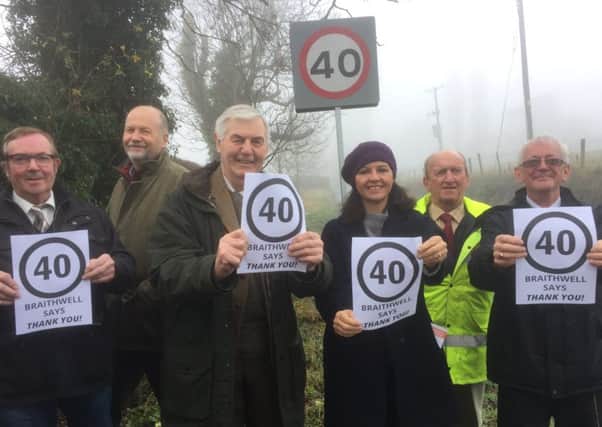 MP Caroline Flint (third right) joins, from left, Coun Martin Greenhalgh, farmer Richard Spencer, businessman Arnold Pawson, Coun John Parkes, chairman of Braithwell Parish Council, and Coun Nigel Cannings to say thankyou for the 40mph speed limit.