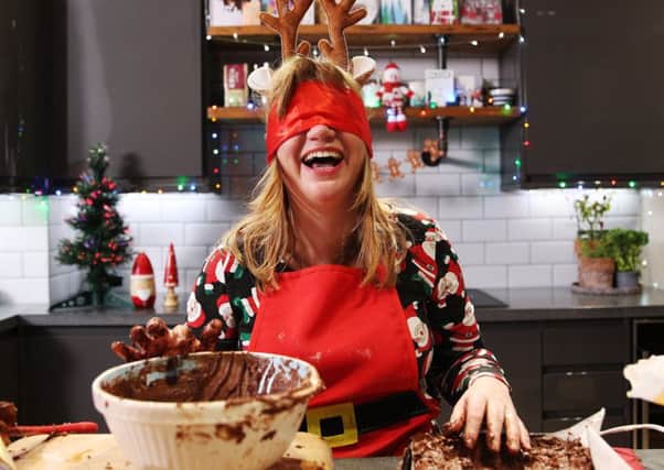 TV star Kate Bottley getting in a right mess while attempting to bake Costa Coffees double chocolate yule log while blindfolded.