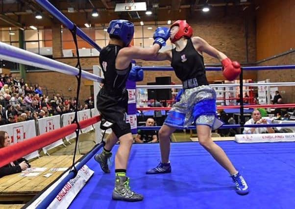 Hollie Towl, of the Xbox Academy in Worksop, in action against Dione Burnham, of Broadstone ABC in Dorset.