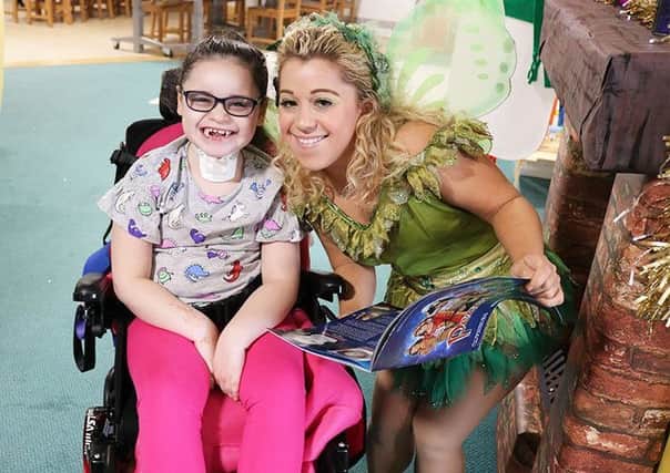 Panto star Jo Osmond with patient Sienna Roberts at Bluebell Wood Children's Hospice.