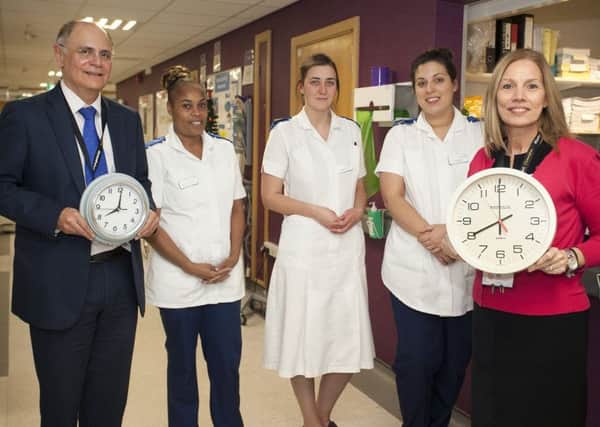 Staff at the hospitals trust showing the new visiting times, which will run to 8 pm.