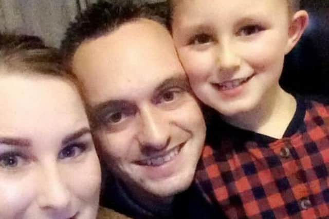 Laura with partner Alex and son.