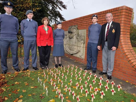 Field of Remembrance in Memorial Gardens, Worksop, pictured with members of Worksop Air Cadets are Coun Sybil Fielding and chairman of Worksop Royal British Legion, Brian Madden