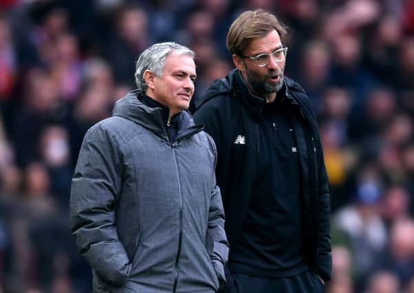 Jose Mourinho and Jurgen Klopp (Photo by Laurence Griffiths/Getty Images)