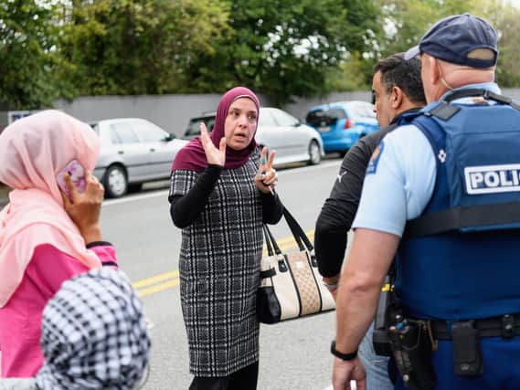 Members of the public react in front of the Masjd Al Noor Mosque as they fear for their relatives on March 15, 2019 in Christchurch, New Zealand.