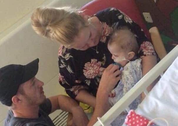 Baby Hunter with his mum and dad, Nikki and Nick, soon after his open heart surgery last year.