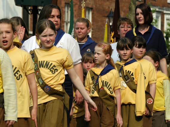 2004: A wonderful close-up of the Brownies joining in the Parade for St Georges Day. Looks like one girl is citing the Brownie Promise.