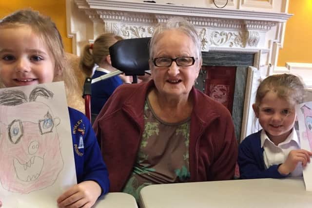 School children have been visiting residents of a care home to help brighten up their day.