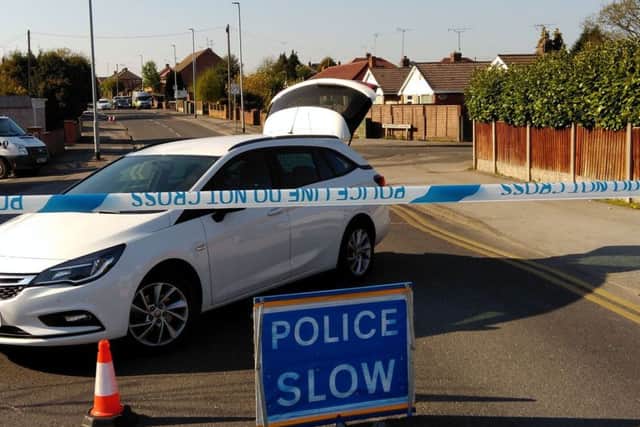 Police sealed-off Park Hall Road, at Mansfield Woodhouse, as part of a murder investigation.