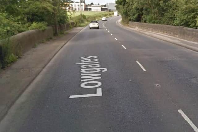 Traffic control (multi-way signals) at A619 Lowgates, Staveley, Derbyshire, at footway from bridge to Bent Lane, due to works being carried out by Severn Trent Water. Delays likely until September 30, 2019.