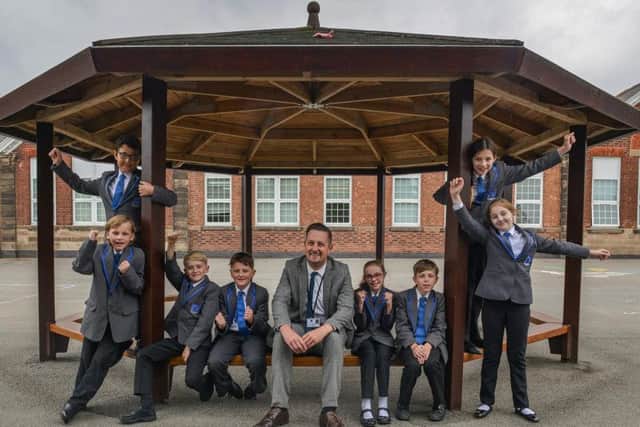 The Parkgate Academy, Ollerton are celebrating a good Ofsted result. Principal Mark Nunn is pictured with pupils.