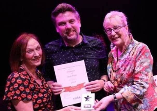 Jeanne Raspin and Neil White collect the award on behalf of Whitwell Players from Jacquie Stedman, the president of the National Operatic and Dramatic Association (East Midlands)..