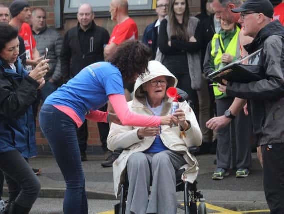 Lorna Riley sounded an air horn to start Clowne Road Runners' annual Handicap Race. Pictures submitted.