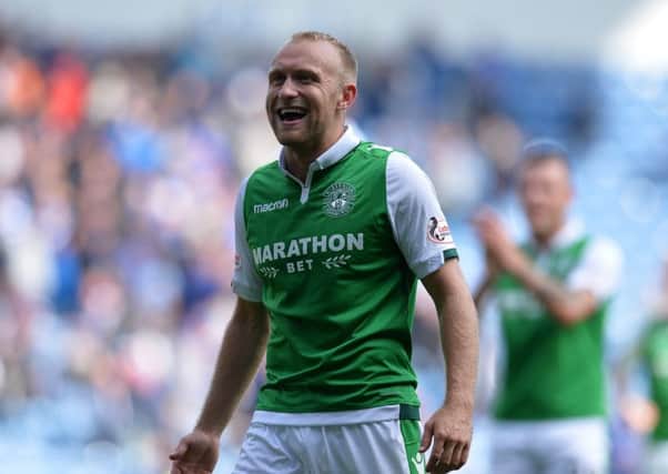 GLASGOW, SCOTLAND - AUGUST 12: Dylan McGeouch of Hibernian smiles at the Hibs fans at the final whistle during the Ladbrokes Scottish Premiership match between Rangers and Hibernian at Ibrox Stadium on August 12, 2017 in Glasgow, Scotland. (Photo by Mark Runnacles/Getty Images)