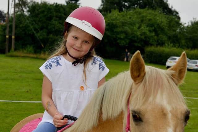 Jessica Chapman, seven, enjoying a pony ride