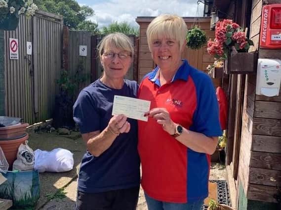 A cheque for 600 is presented to Elaine Shaw from Notts Super Dogs