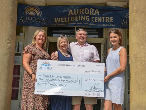 Cheque presentation to Aurora Wellbeing Centre, Worksop from newlyweds Simon and Debbie Wilsher, the couple present their cheque to manager Deborah Fores and Macmillan Wellbeing Practitioner, Emma Walker
