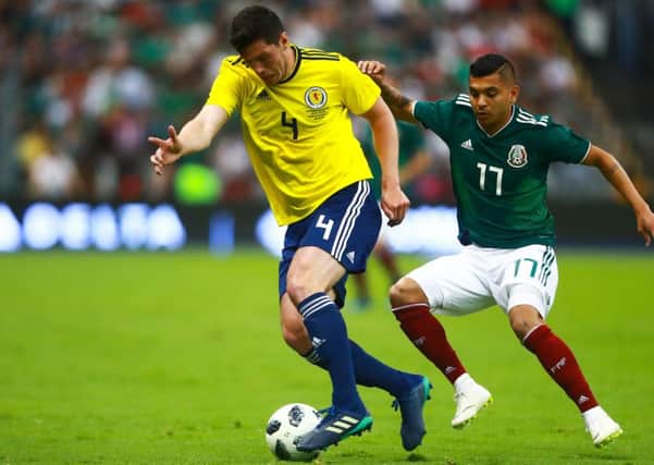 MEXICO CITY, MEXICO - JUNE 02: Jesus Manuel Corona of Mexico struggles for the ball with Scott McKenna of Scotland during the International Friendly match between Mexico v Scotland at Estadio Azteca on June 2, 2018 in Mexico City, Mexico. (Photo by Hector Vivas/Getty Images)