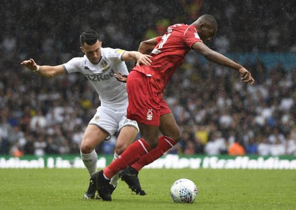 LEEDS, ENGLAND - AUGUST 10: Jack Harrison of Leeds United battles for the ball with Samba Sow of Nottingham Forest during the Sky Bet Championship match between Leeds United and Nottingham Forest at Elland Road on August 10, 2019 in Leeds, England. (Photo by George Wood/Getty Images)