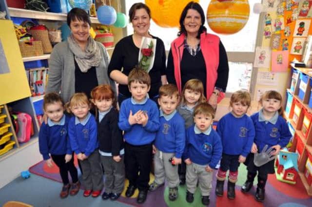 Guardian Rose presentation to Little Acorns Pre-School commitee members.  Pictured presenting the rose is Louise Passaseo, left with Kerry Aspinall and Gay Underwood (w130117-2b)