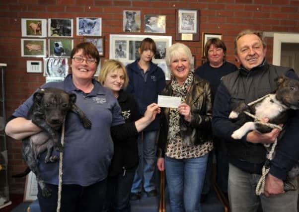 Cheque presentation to Thornberry Animal Sanctuary from local lady Wendy Byrne who won on Dale Winton's In It To Win It quiz show, Wendy is pictured presenting the cheque to Thornberry staff (w130204-3)