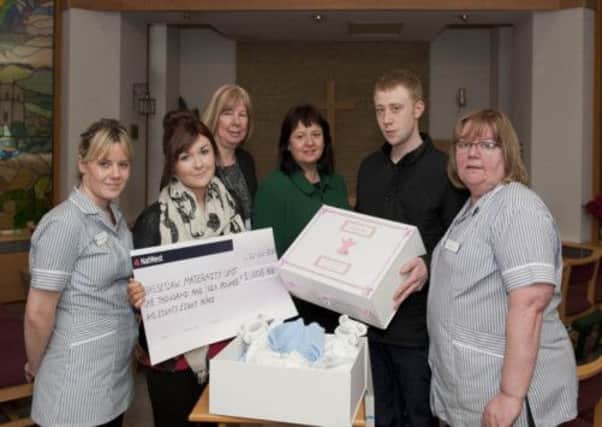 Ashley Baxendale and her partner Alex Wade donated memory boxes and a cheque £1006.88  to the Bassetlaw Hospital Maternity Unit on Tuesday in memory of their baby who was stillborn. At the presentation were (left to right): midwife, Jenna Atherton; clinical lead midwife, Karen Cousins; head of midwifery, Deirdre Fowler and midwife Maura Moss