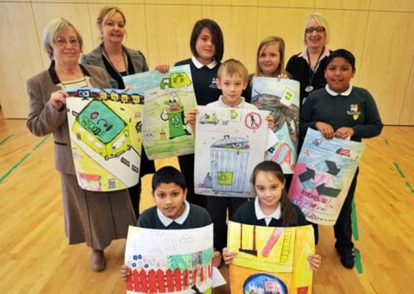 Pupils at Ryton Park Primary School have designed new logos for Bassetlaw Council tax brochure and website, pictured are the winners and runners up with from left Coun Sylvia May, Sarah Carter and Adele Watson
