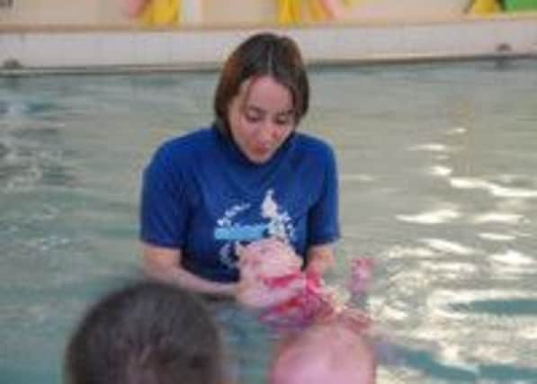 Sarah Sundin teaching at a Water Babies class