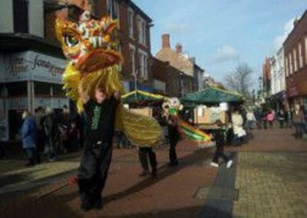 STMA Fitness kung fu studio perform their traditioanl Chinese lion dance in Worksop town centre