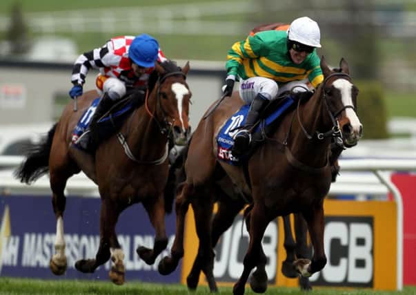Tony McCoy on Synchronised as they go on to win the Betfred Cheltenham Gold Cup Steeple Chase during day four of the 2012 Cheltenham Fesitval at Cheltenham Racecourse, Gloucestershire. PRESS ASSOCIATION Photo. Picture date: Friday March 16, 2012. See PA story RACING Cheltenham. Photo credit should read: David Davies/PA Wire. RESTRICTIONS: Use subject to restrictions. Editorial use only including book use. No commercial use. Call +44 (0)1158 447447 for further information.