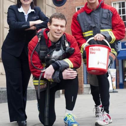Firefighters Paul Mclafferty and Russell Kay who with the support of Katie Scott Natwest Retford Branch Manager are collecting sponsors to raise funds for The Firefighters Charity as part of team who will be jogging 100K from London to Brighton4 March  2013Image © Paul David Drabble