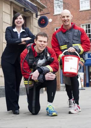 Firefighters Paul Mclafferty and Russell Kay who with the support of Katie Scott Natwest Retford Branch Manager are collecting sponsors to raise funds for The Firefighters Charity as part of team who will be jogging 100K from London to Brighton

4 March  2013
Image © Paul David Drabble