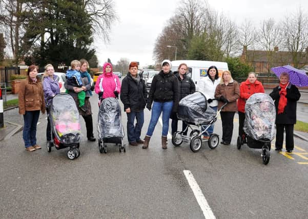 Parents of children attending Tuxford Primary School protest over Notts County Council plans not to employ a lollipop lady when the present one retires shortly, Coun Shirley Isard is pictured far right (w130315-7a)