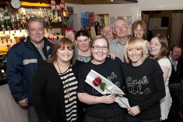 Grafton Hotel landlady Suzi Hale (left) presented Kerry Marsden (centre) and Karen Hale with the Guardian Rose on Friday for all their help as she copes with serious helth problems