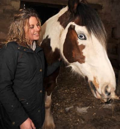 Feature on the Coloured Cob riding school which has won an award for its work with riders with mental health problems, pictured is owner Sharon Tolley with Charlie (w130315-4b)
